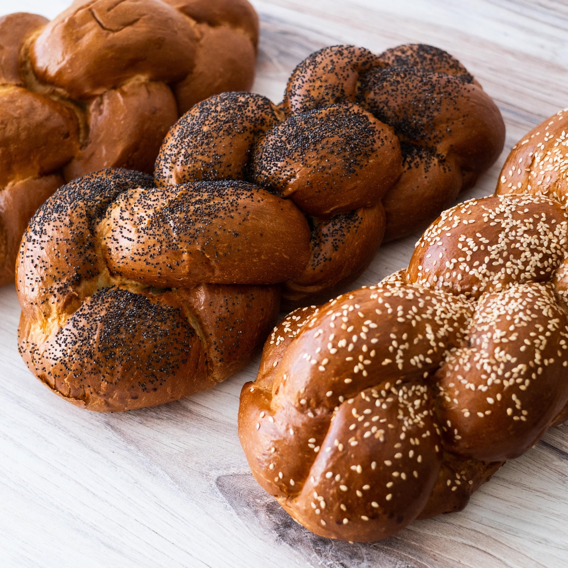 Our one pound challah come with sesame or poppy seeds or plain.  It will feed four to six people at the Sabbath dinner.